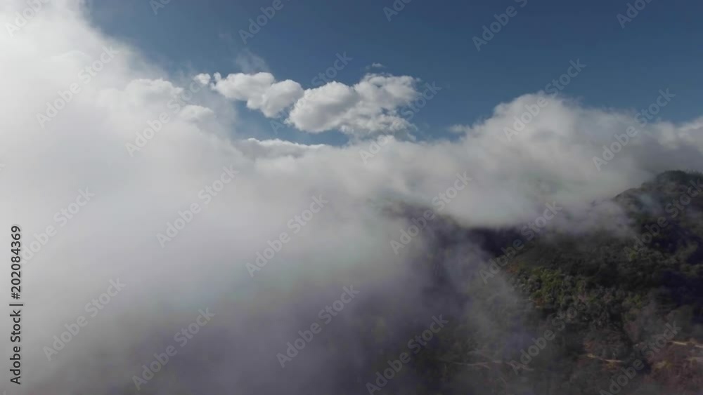 Flying towards cloud covered moutains Flying towards cloud covered moutains