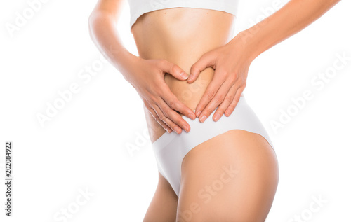 woman dressed in white underwear , slim stomach, concept ideal body, sport training and diet. © Peakstock