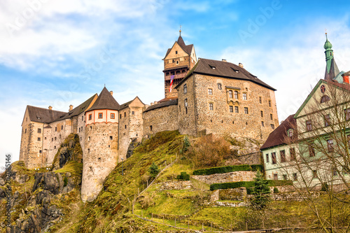 Amazing landmark in Czech Republic, near Karlovy Vary Loket middleaged castle with blue sky in spring.