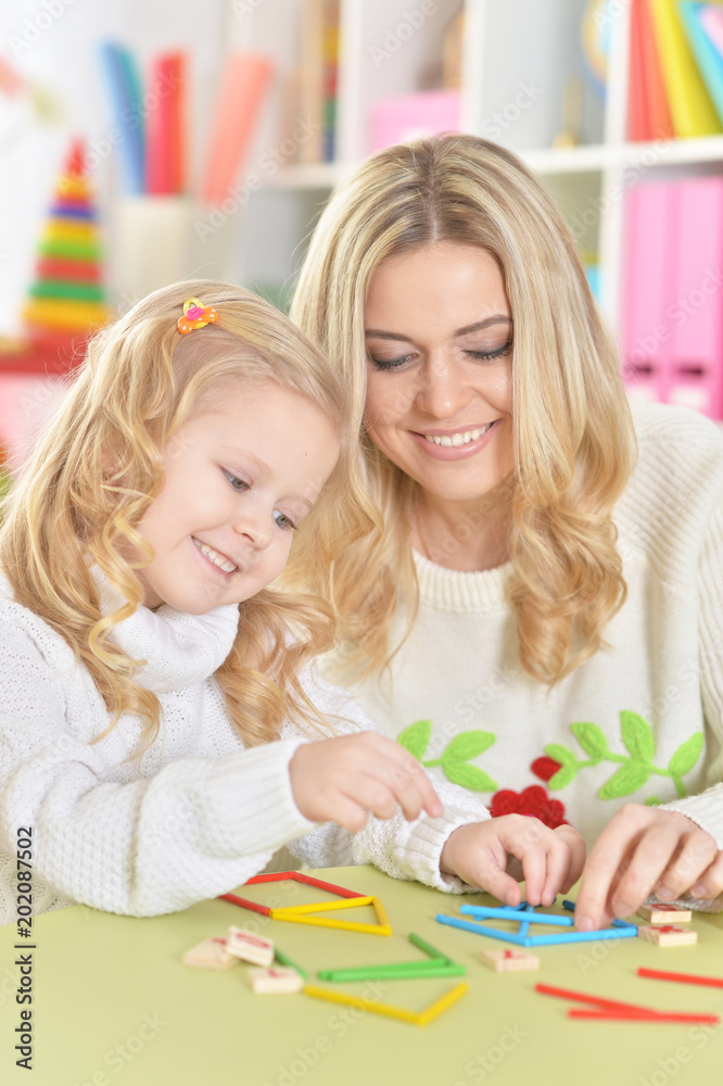 Mother with little daughter counting Mother with little daughter counting