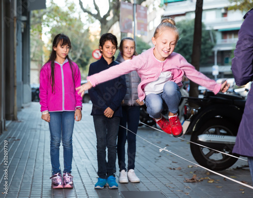 smiling children play on street