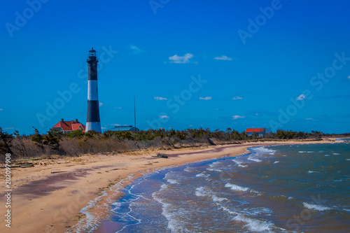 Outdoor view of Atlantic ocean waves on the beach at Montauk Point Light, Lighthouse, located in Long Island, New York, Suffolk County