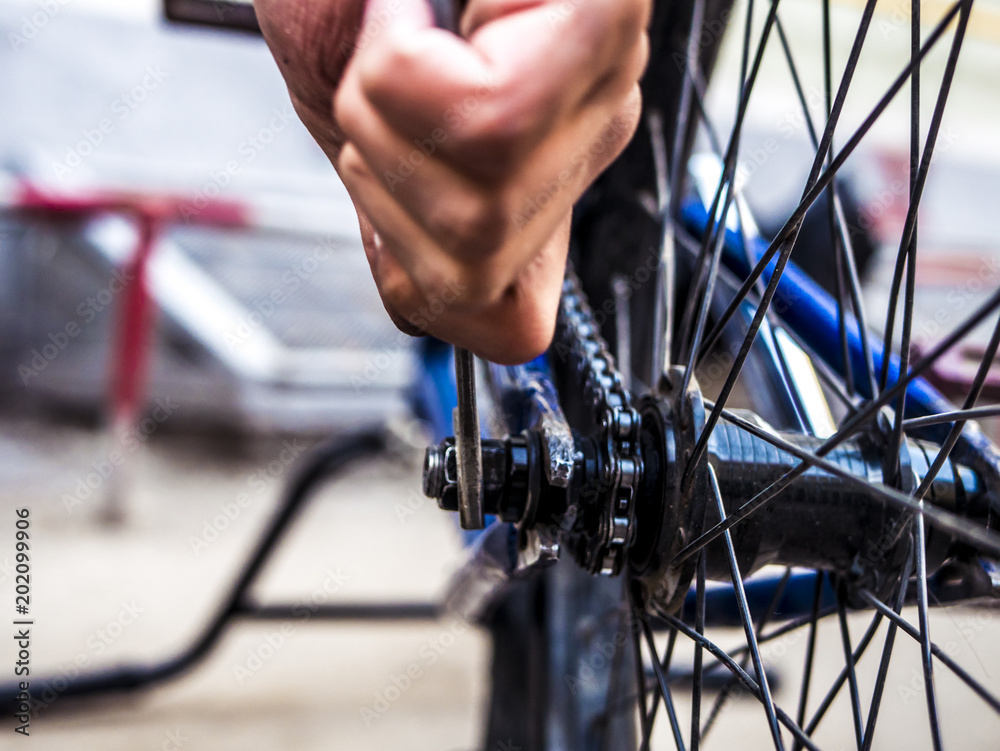 close up bicycle man repairing the chain close up bicycle man repairing the chain