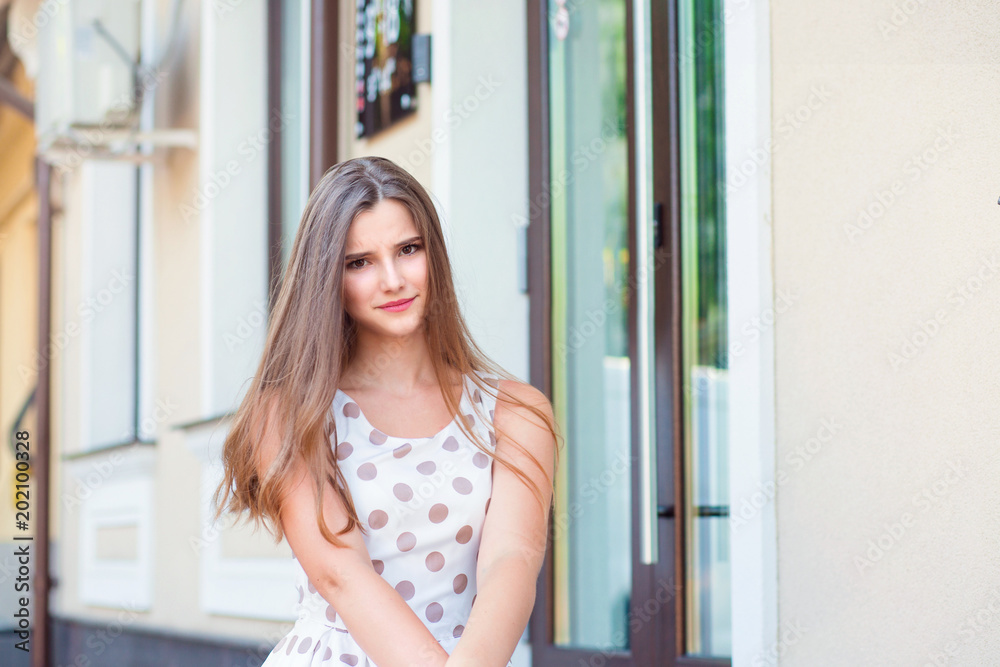 Outdoors portrait of a beautiful suspicious skeptical woman. Outdoors portrait of a beautiful suspicious skeptical woman.