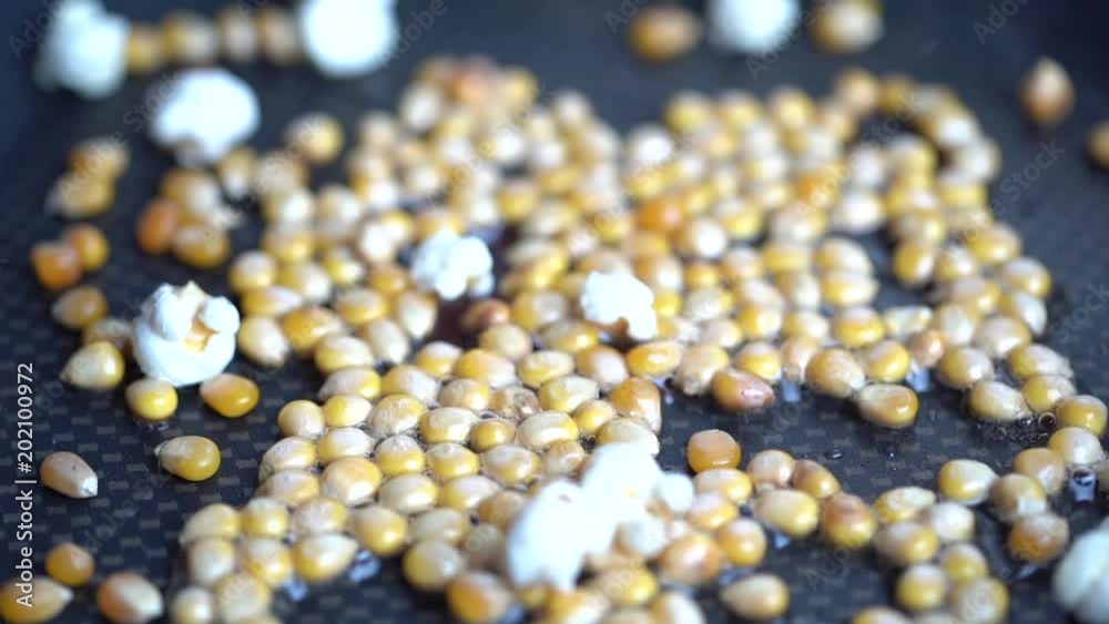 Popcorns popper in a pan with macro video - 100 fps slow motion 1920x1080p HD Popcorns popper in a pan with macro video - 100 fps slow motion 1920x1080p HD