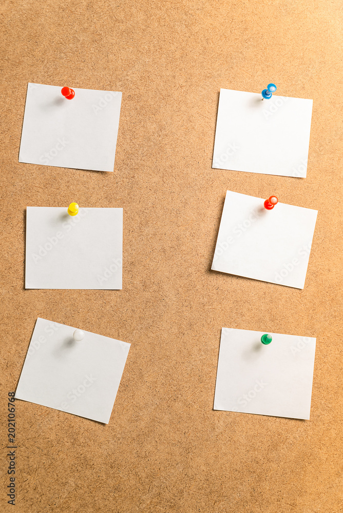 six white stickers for taking notes on a cardboard background six white stickers for taking notes on a cardboard background