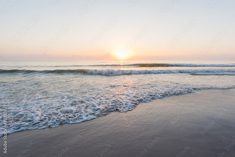 Beautiful gentle wave at the shallow beach in morning