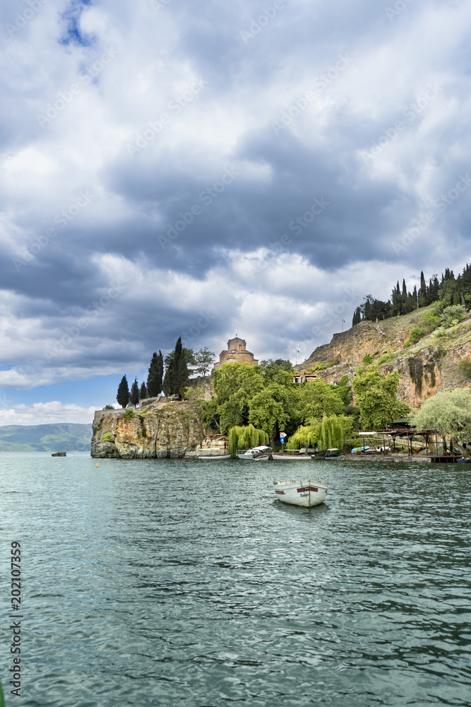 Lake view of St Kaneo ancient church and landmark in the city of Ohrid in Macedonia, vertical