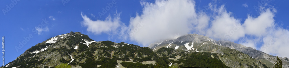 Panorama of Vihren mountain summit under fog, Pirin, Bulgaria