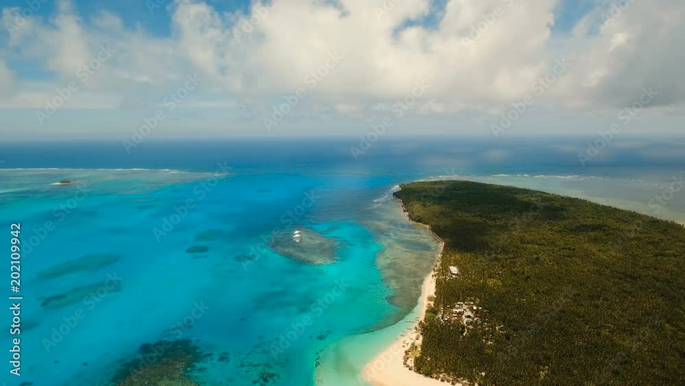 Aerial view of beautiful tropical island Daco with white sand beach. View of a nice tropical beach from the air. Beautiful sky, sea, resort. Seascape: Ocean and beautiful beach paradise. Philippines Aerial view of beautiful tropical island Daco with white sand beach. View of a nice tropical beach from the air. Beautiful sky, sea, resort. Seascape: Ocean and beautiful beach paradise. Philippines