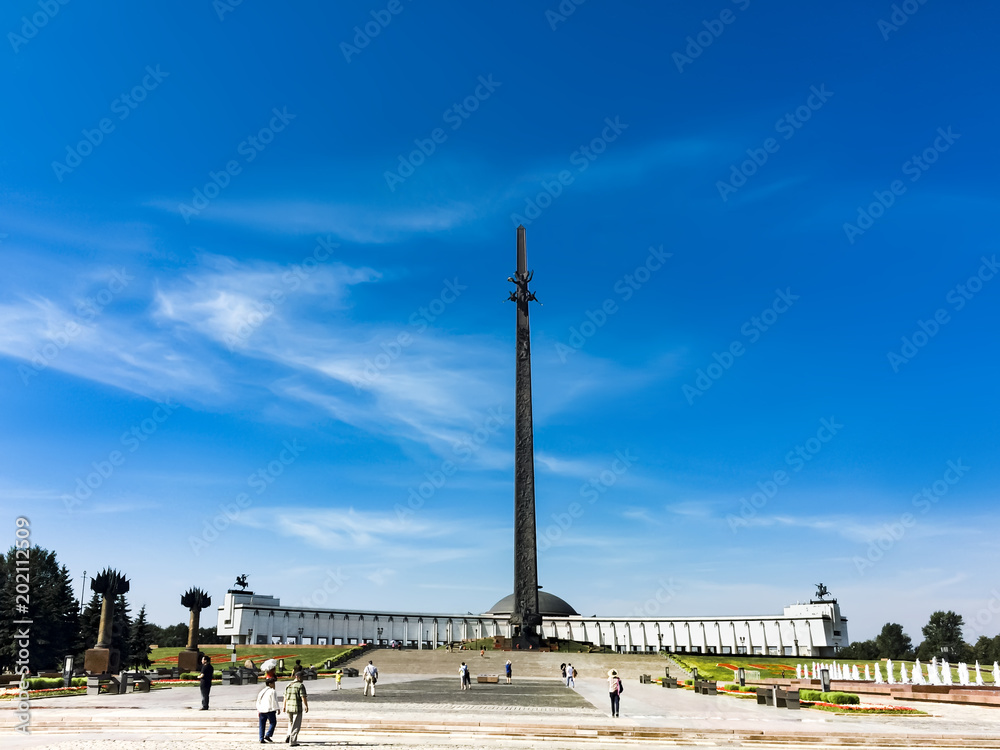Moscow, Russia - 06 August 2017: Unknown People and tourists walk on the main avenue of the Victory Park at the Victory Monument and the obelisk in the May holidays May 6, 2016, Moscow, Russia