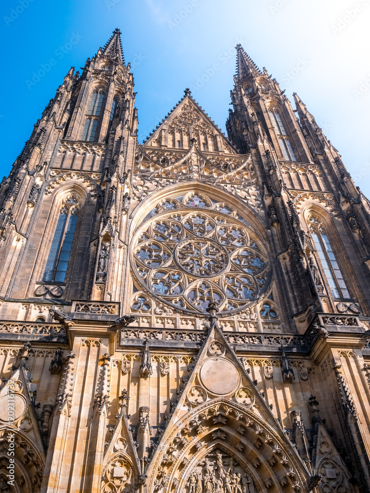 Fototapeta premium St. Vitus cathedral in Prague Castle front view of the main entrance in Prague, Czech Republic.Blue sky sunny background winter season.Landmark historical destination travel.