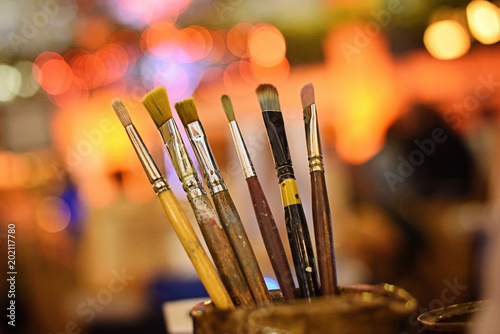 set of paintbrushes on colorful background.