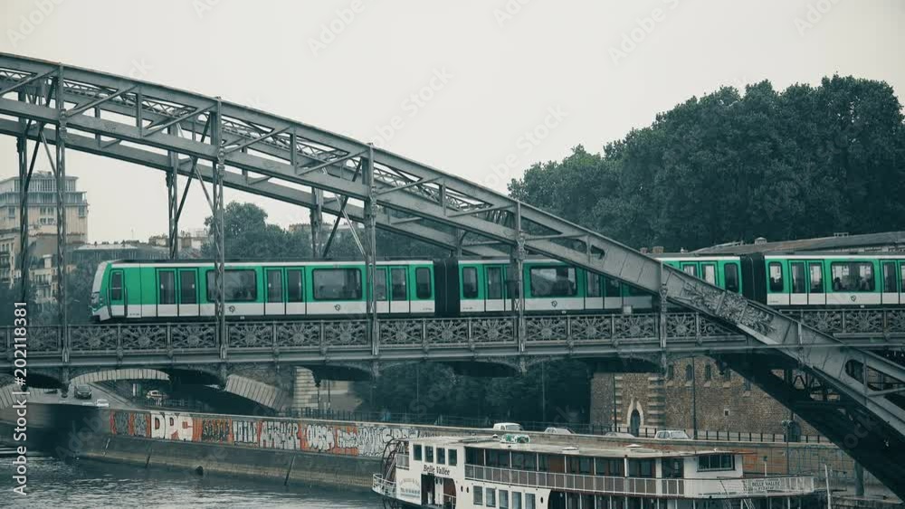 PARIS, FRANCE, circa MAY, 2017. New metro train MF2000 traveling on line 5 of the Paris subway network over Austerlitz bridge PARIS, FRANCE, circa MAY, 2017. New metro train MF2000 traveling on line 5 of the Paris subway network over Austerlitz bridge