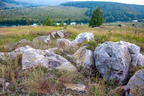 Sacred stones in the area of the village of Krasnogorye. The nature monument Witches stones. The valley of the Krasivaya Mecha River. Tula region, Russia photo