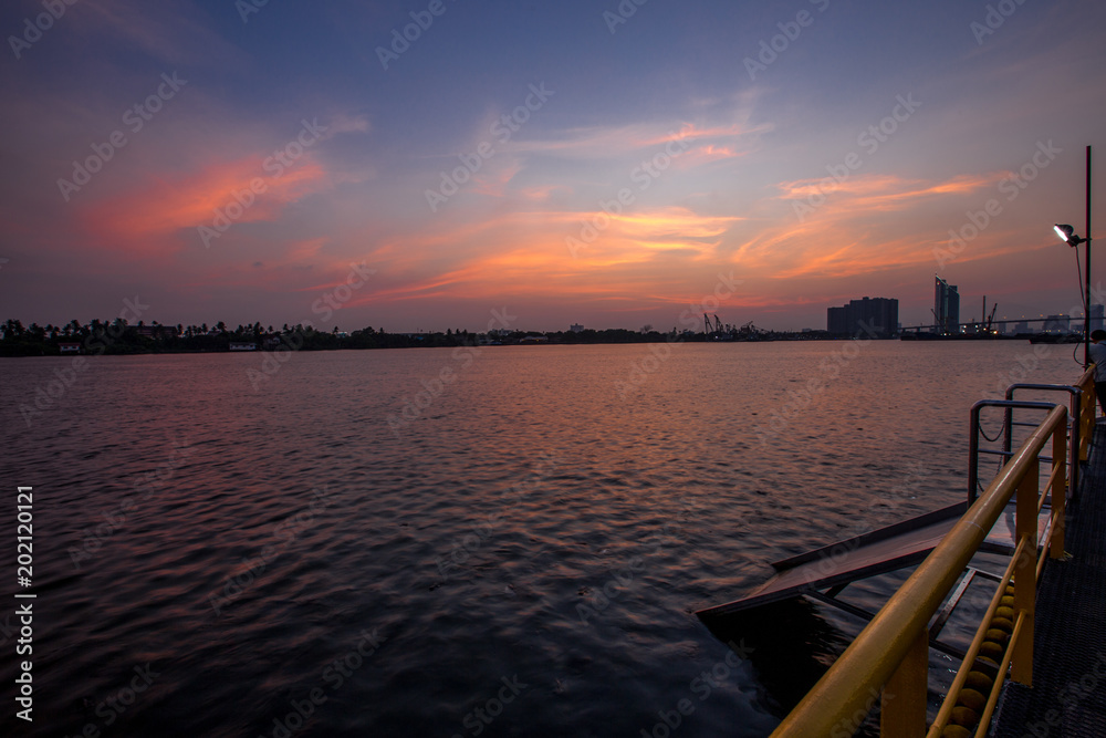The sun is in the evening. The Chao Phraya River (Wat Pariwat) Bangkok Thailand