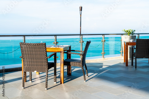 patio chair and table with sea view background