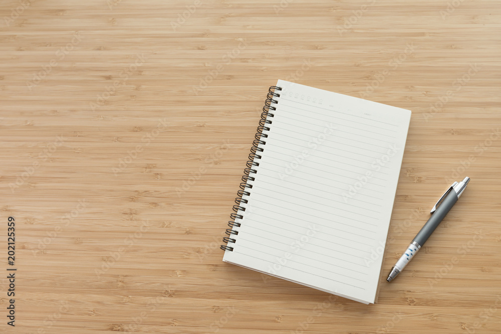 Blank notebook on desk background. Blank notebook on desk background.