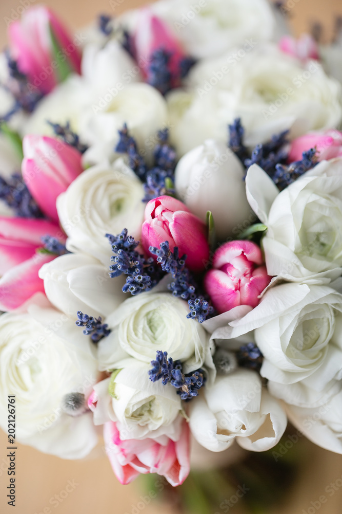 Wedding bouquet of pink tulip and white buttercup. Modern bridal bunch. Dry lavender Wedding bouquet of pink tulip and white buttercup. Modern bridal bunch. Dry lavender