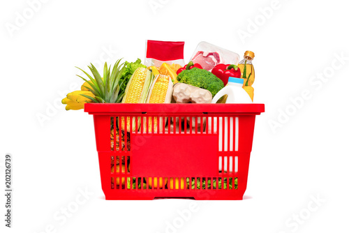 Red shopping basket full of food and groceries