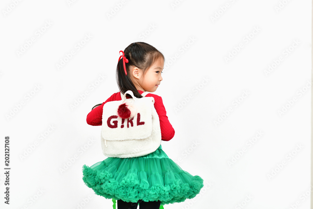 Little girl celebrates Christmas with red Santa dress. Little girl celebrates Christmas with red Santa dress.