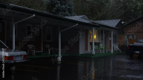 Zoom-in on motel cabins on a rainy evening near Grants Pass, Oregon