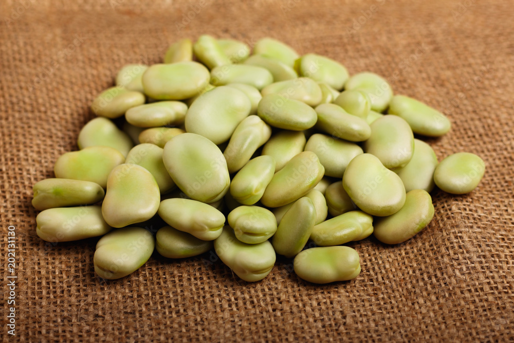 fresh broad beans on a rustic background fresh broad beans on a rustic background