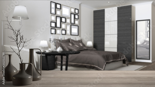 Wooden table top or shelf with minimalistic modern vases over blurred classic hotel bedroom  white interior design