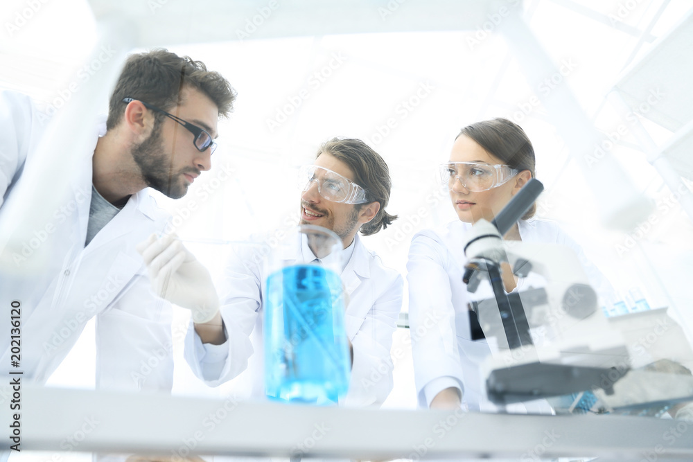 Group of scientists working on an experiment at the laboratory