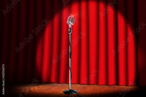 retro microphone on stage with red curtain