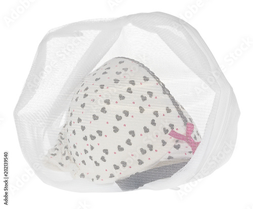 Wash bag for delicate clothes, shoes, underwear, bra. A laundry bag made of white mesh filled bras.