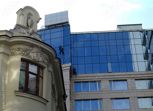 Photography Industrial alpinism. Window washers at Lotte Hotel Moscow.