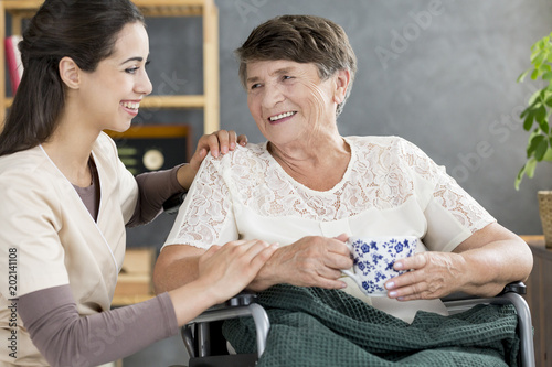 Caregiver talking to pensioner