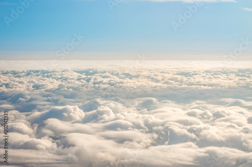 Panorama sky from altitude in the cumulus and layered stratus clouds.