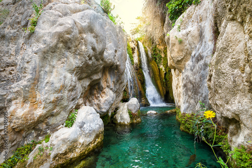 Algar Waterfalls at only 15 km from Benidorm and 3 km from the center of Callosa d'en Sarri , direction Bolulla, you can find a natural area with a high degree of conservation of the ecological photo