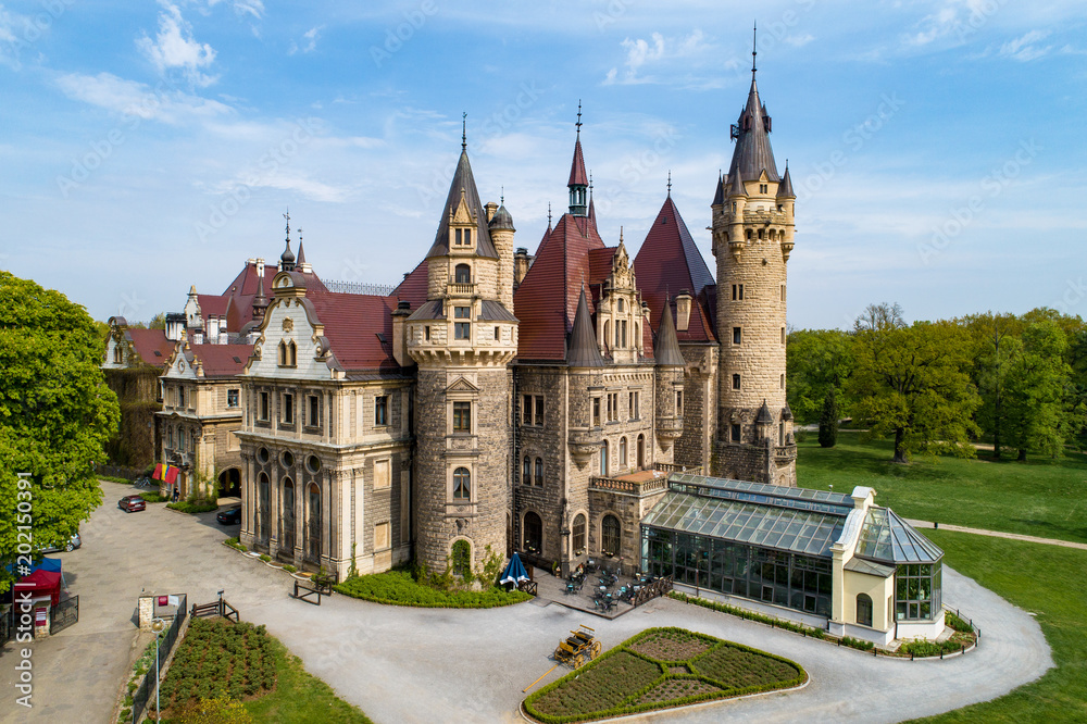 Obraz premium Fabulous historic castle in Moszna near Opole, Silesia, Poland. Built in XVII century, extended from 1900 to 1914. One of the best known and most beautiful monuments in Upper Silesia. Aerial view