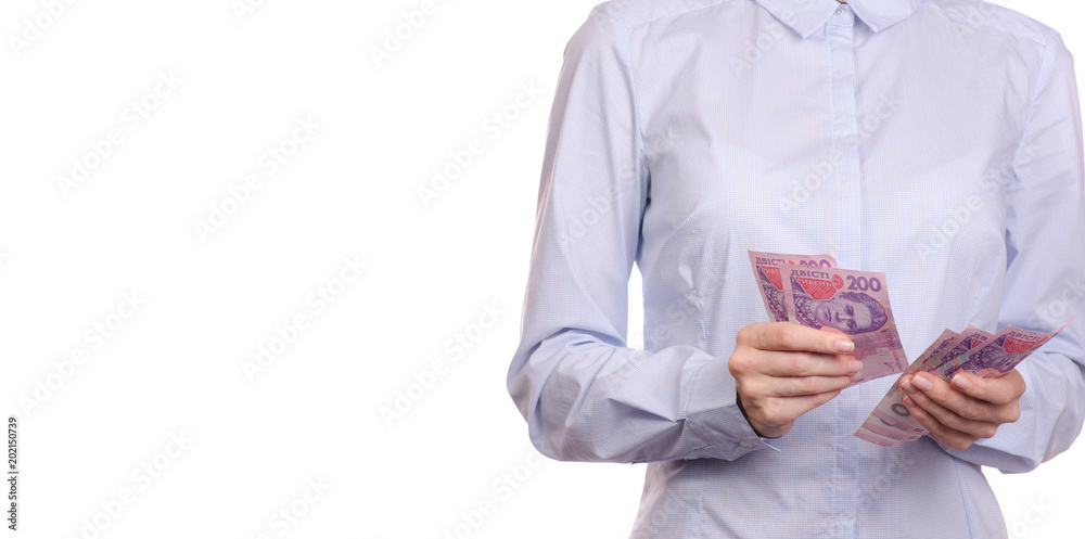 Woman in a shirt in the hands money hryvnia Woman in a shirt in the hands money hryvnia