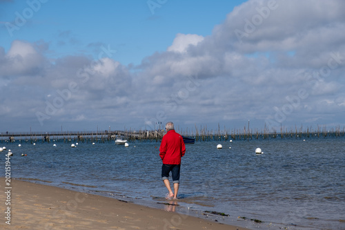 Senior man walking on the beach