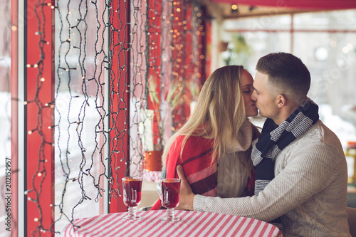 Kissing couple in a cafe