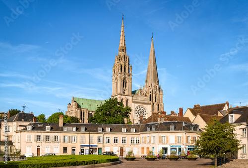 Chartres, France - May 21, 2017: View to Cathedral of Our Lady of Chartres from Place Chatelet. Unidentified people present on picture. Copy space in sky.