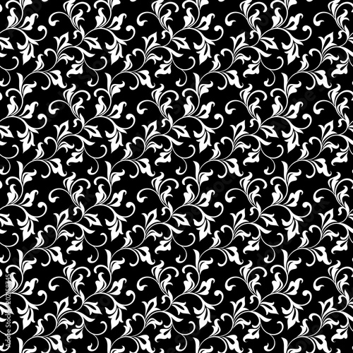 Luxurious seamless pattern. Vegetative motive. White swirls and foliage on a black background. Ideal for textile print and wallpapers.