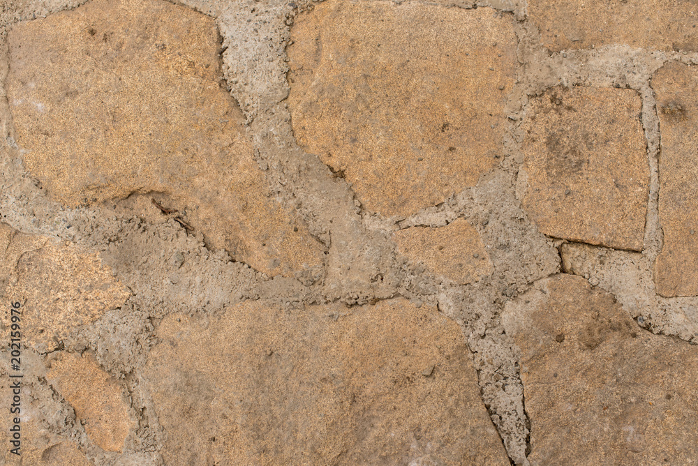 Background of stone-paved uneven track Background of stone-paved uneven track