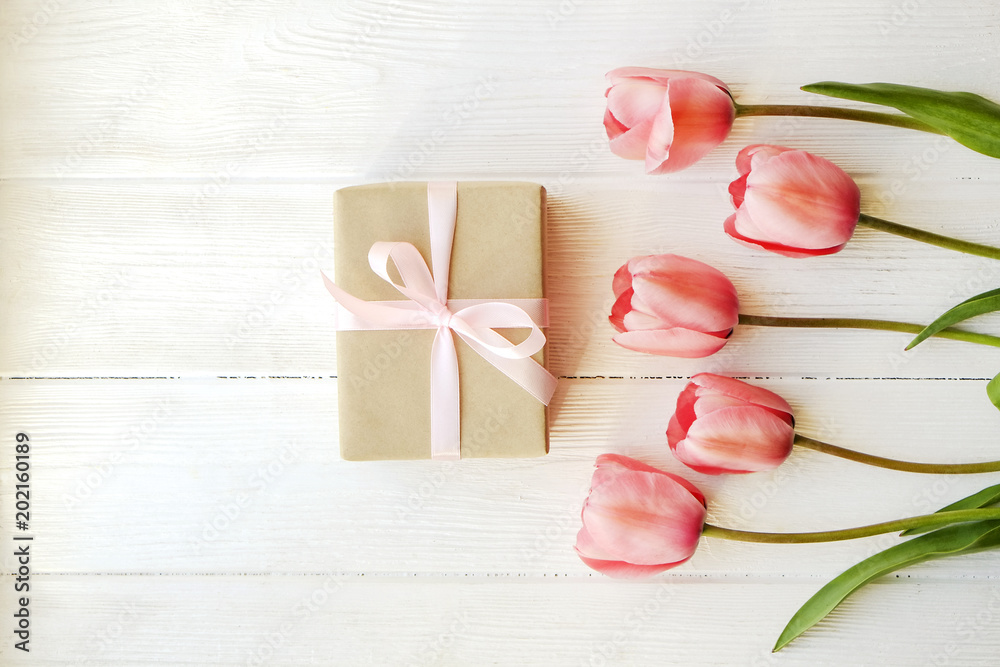 Beautiful spring holidays flowers arrangment. Bunch of white tulips in festive composition, copy space for text, white background.