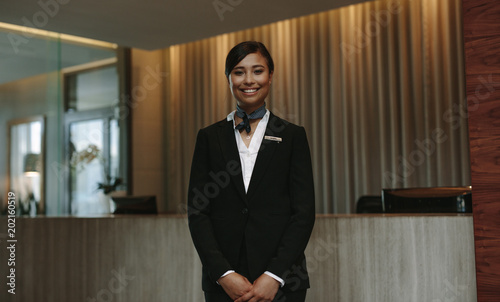 Female hotel receptionist ready to greet guest