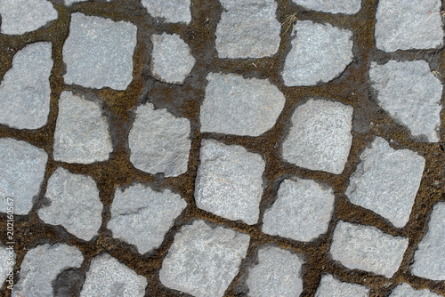 Background of stone-paved uneven track