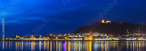 Night panorama of the beautiful city of Viana do Castelo, Portugal. View of the river Lima, Santa Luzia and hospital ship Gil Eanes photo