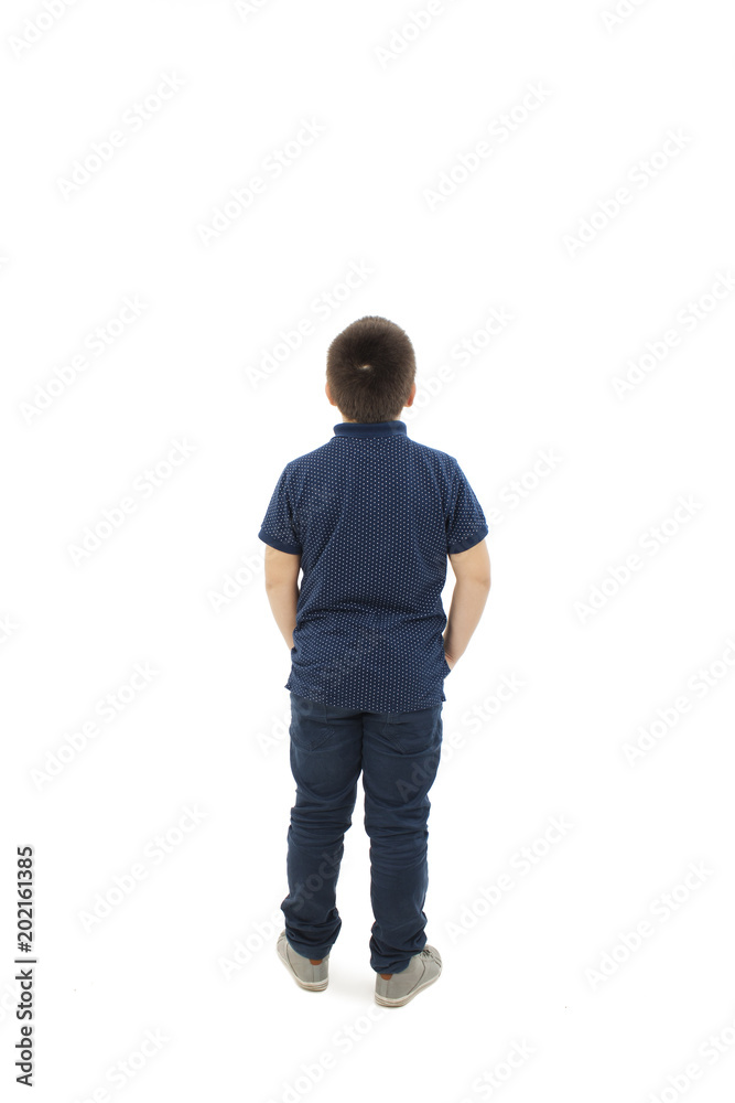 Adorable little boy looking at wall. Rear view, Isolated on white background Adorable little boy looking at wall. Rear view, Isolated on white background