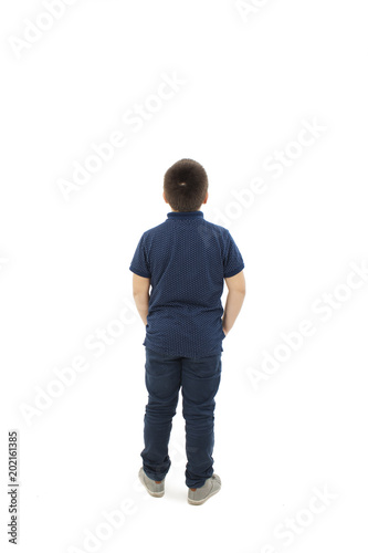 Adorable little boy looking at wall. Rear view, Isolated on white background 