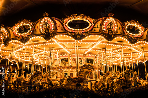 Merry-Go-Round (carousel) illuminated at night. 