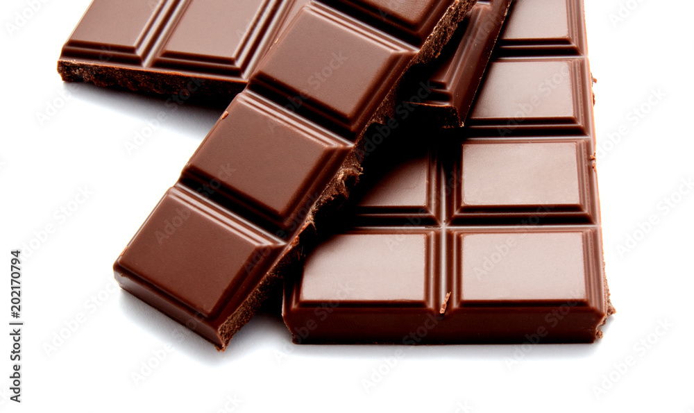 Fototapeta premium Dark milk chocolate bars stack isolated on a white